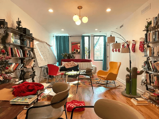The Commonwell common room — bookshelves, whiteboard, and shared seating